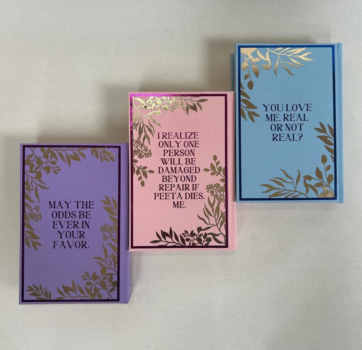 fayrchilds's tweet photo. this rebind of the hunger games trilogy is GORGEOUS are you kidding me https://t.co/SuSSoFeTdF