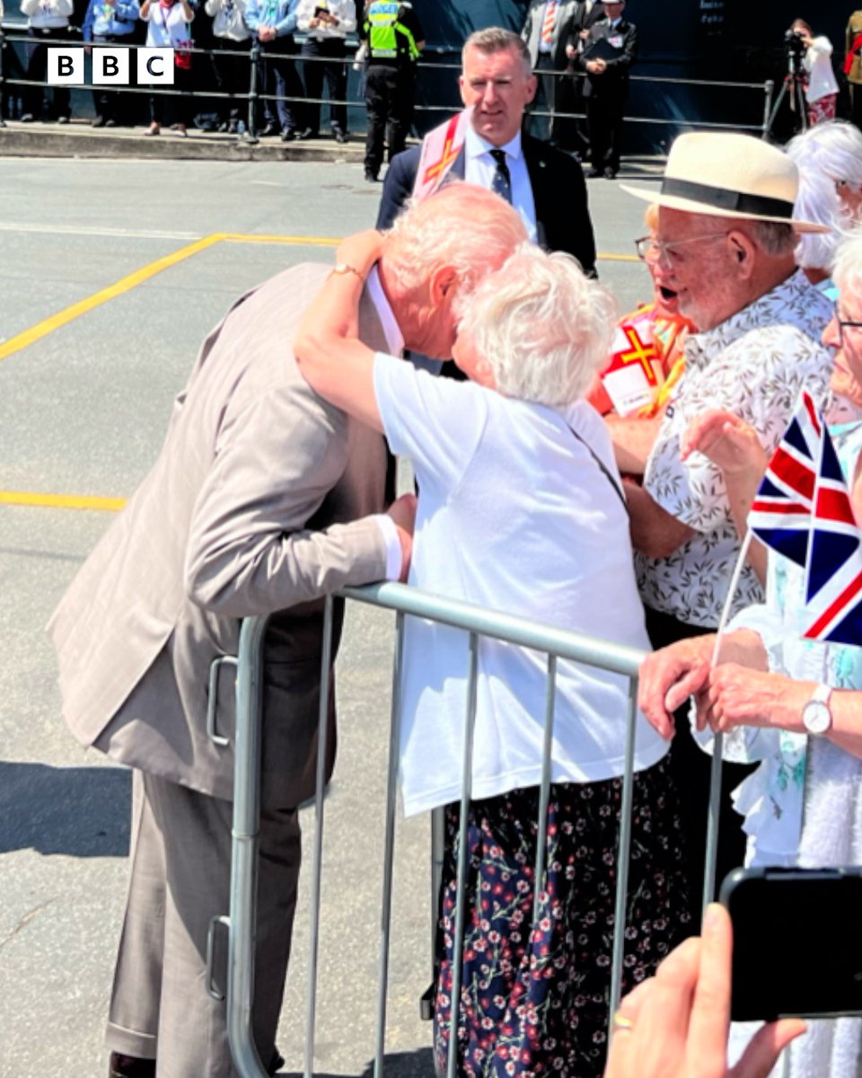 Photo of 91-year-old Kathleen Moriarty giving King Charles III a peck on the cheek