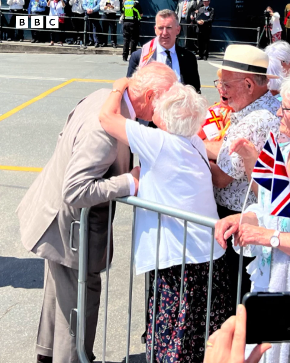 Photo of 91-year-old Kathleen Moriarty giving King Charles III a peck on the cheek