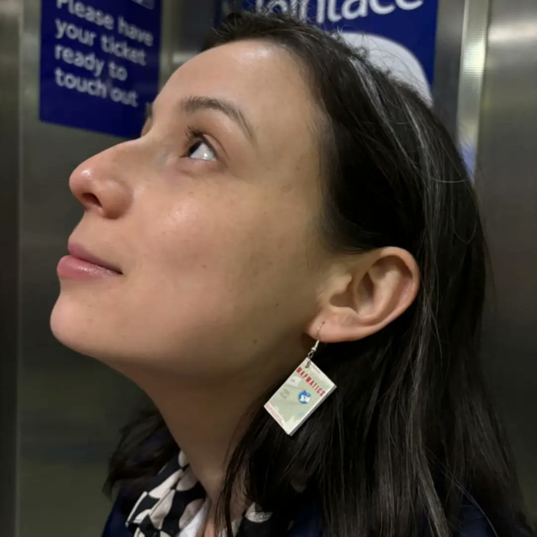 PaulaRowinska's tweet photo. Let me introduce Melissa, the most committed fan of #Mapmatics, and the world's only Mapmatics earrings. 📚🗺👂 https://t.co/Yktt5uJH3f