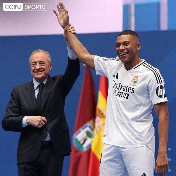 trending_in_KE's tweet photo. Kylian Mbappe poses with Real Madrid's iconic No.9 shirt for first time alongside Florentino Perez after officially completing long-awaited transfer https://t.co/y2C6EwlJJW