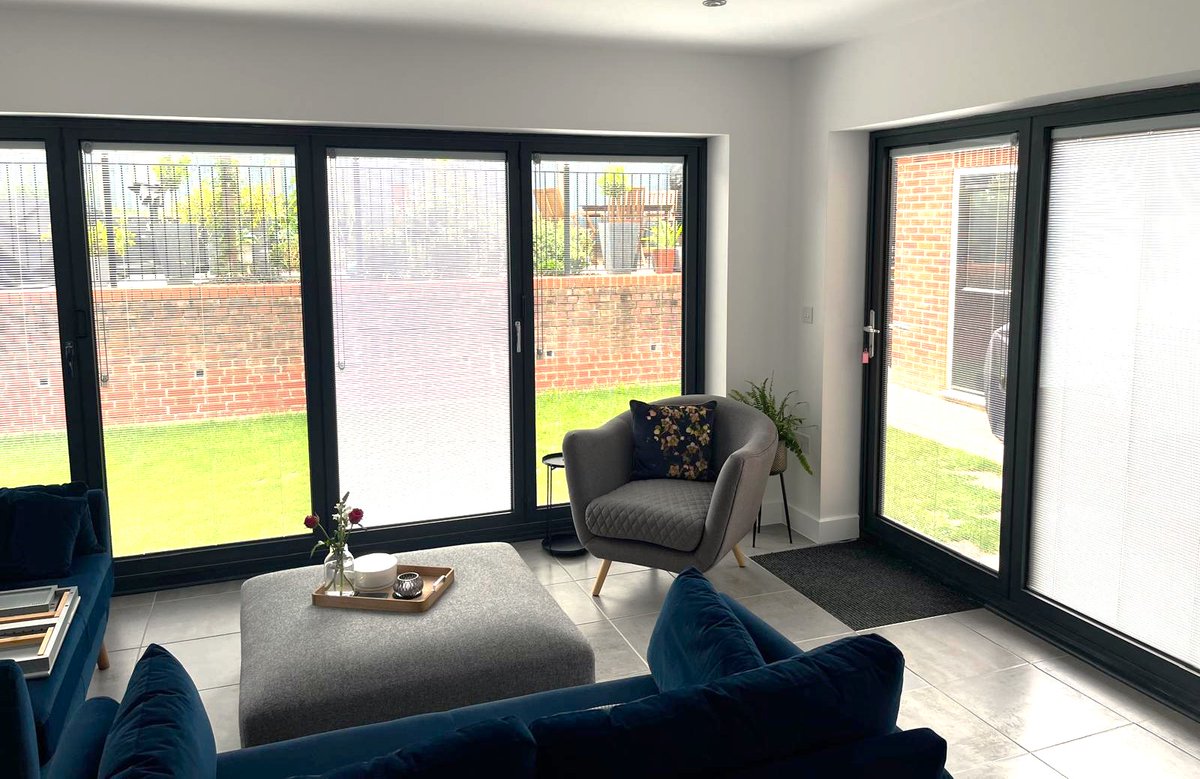 Internals &amp; externals of a recent project. 4 panel bifold doors downstairs, 2 panel bifold with windows upstairs for ventilation in the bedroom. 
All units have in-glazed Venetian blinds, invaluable to control light &amp; shade. Encapsulated, they never get dusty &amp; don't get damaged