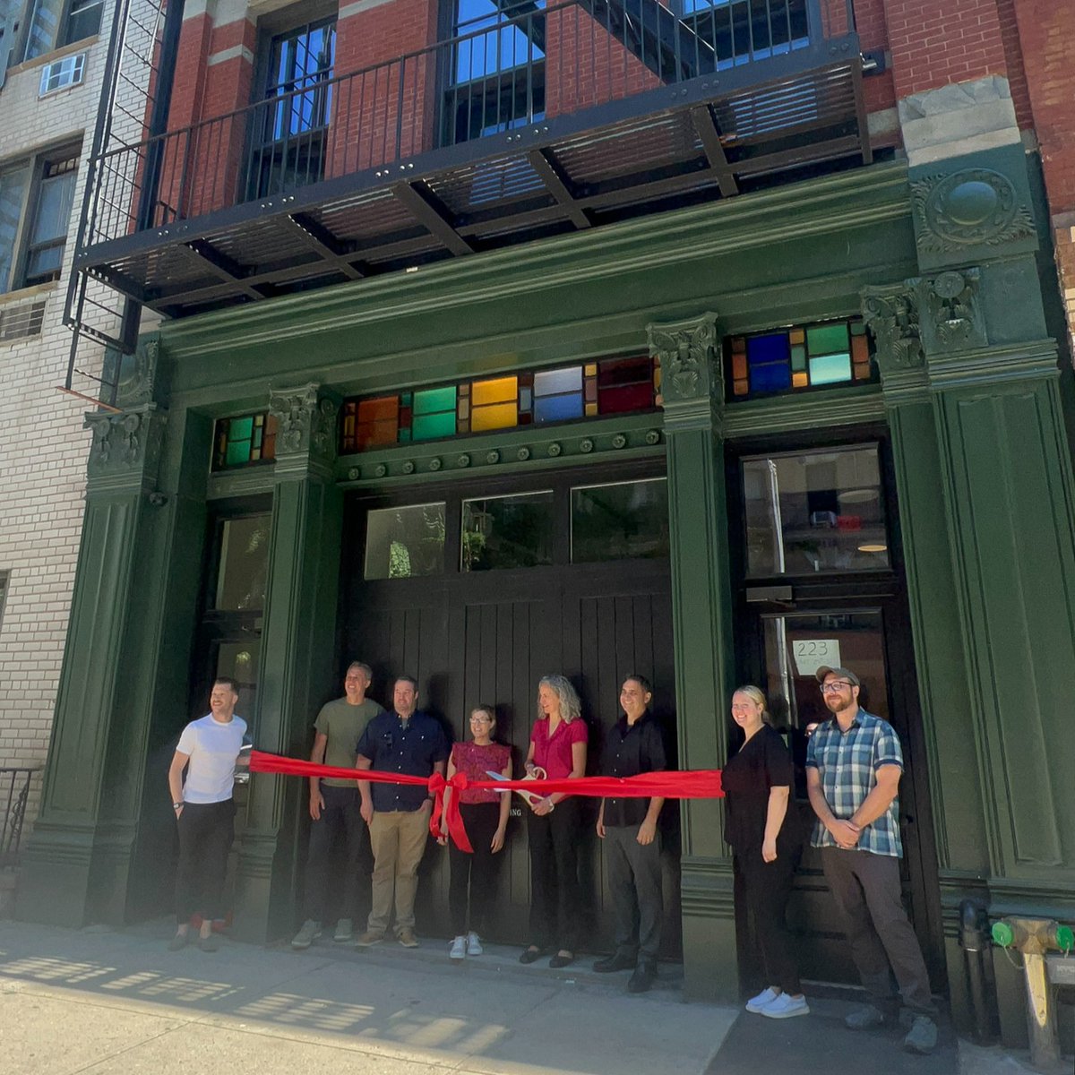 NYSERDA's tweet photo. 🚧 Summer of Shovels: Showcasing projects making strides toward a cleaner, greener NYS. Our NYSERDA team celebrated the 🎀 ✂️ of Engine 16 in NYC. This round 1 #BuildingsofExcellence winner transformed an old firehouse into clean multifamily housing. #SummerofShovels https://t.co/g01XTYJWLW