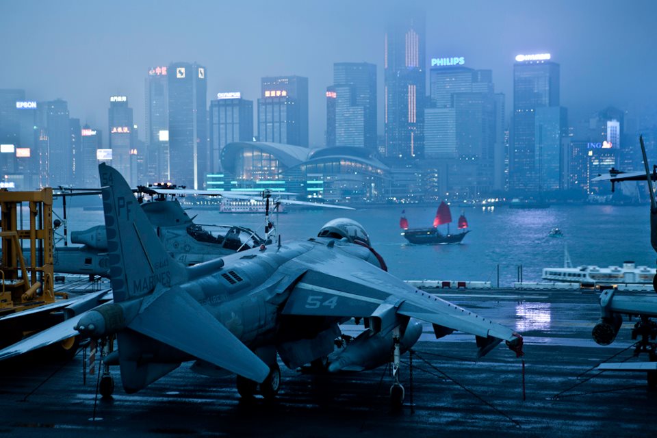 kane's tweet image. Nothing is more cyberpunk than this pic of the USS Peleliu and its Harrier attack wing in Hong Kong.