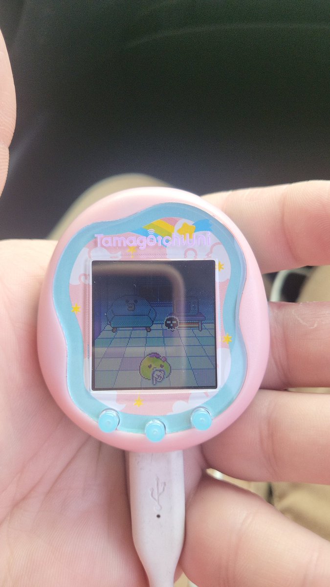 My wife surprised me with this new Tamagotchi. I'm going to attach it to my purse. Colors are just a coincidence 💖