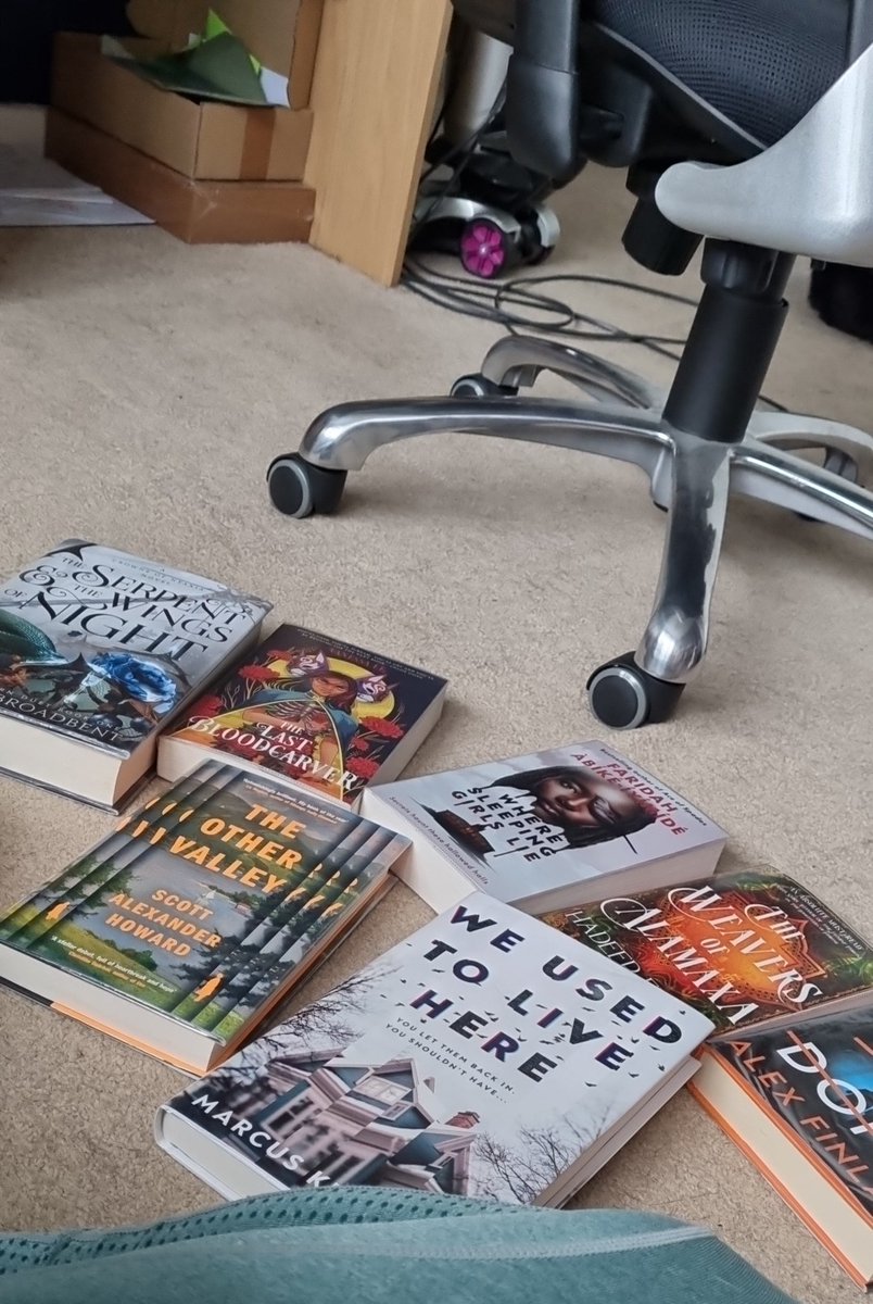 all of my library holds came in at once and now I'm overwhelmed (Serpent wasn't a hold, it was just chilling there on the shelf so obviously I nabbed it)