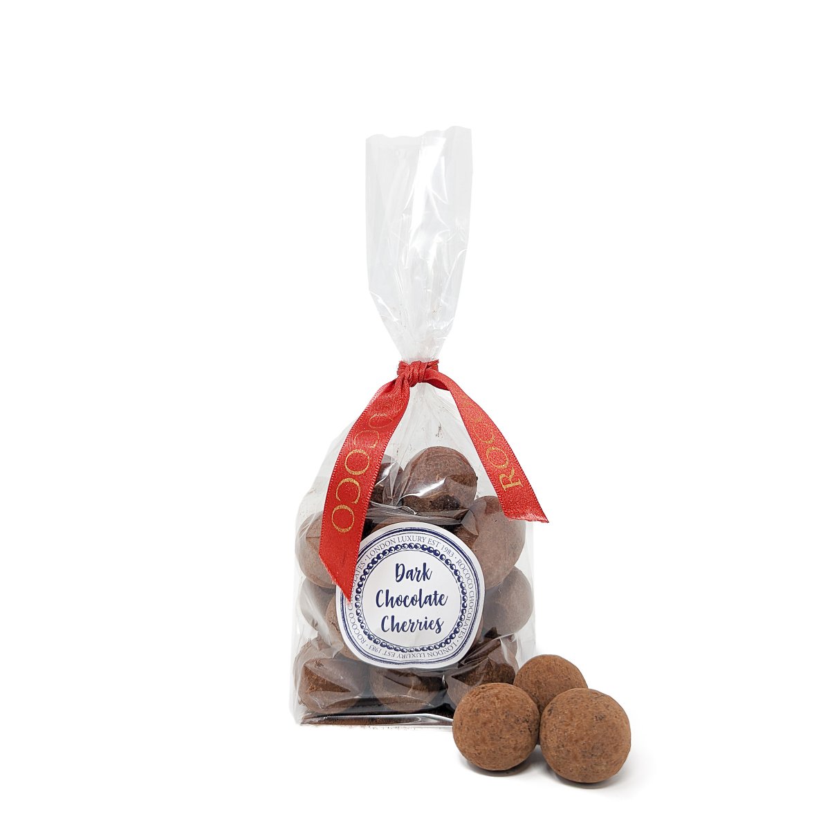 Experience the indulgence of Rococo Dusted Dark Chocolate Covered Cherries. Juicy Amarena cherries are enrobed in luscious dark chocolate and finished with a delicate dusting of cocoa powder. A moreish treat that transports you straight to Italy, in time for the holidays.