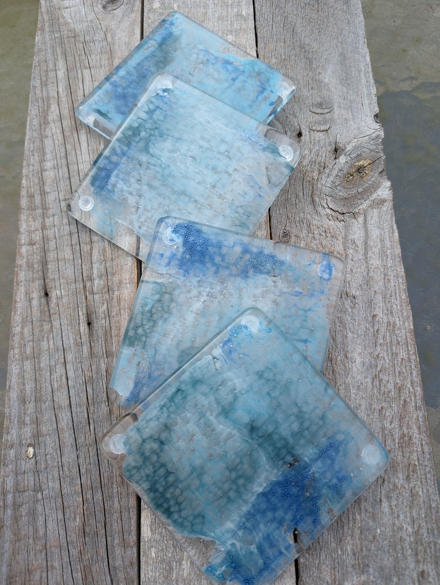 Beautiful "Wash of the sea" fused glass coasters. Amazing bumbling blues, greens and whites within these fused glass handcrafted coasters. 

#shopindie #homedecor #handmade #etsy #giftideas #coasters 

buff.ly/4bWDykB