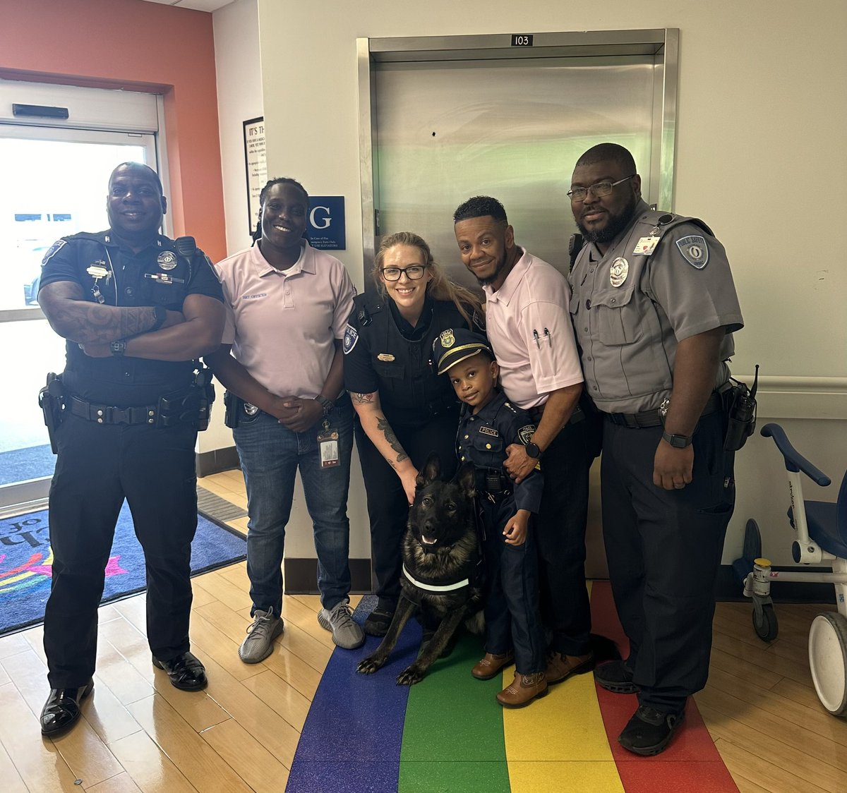 UMMCPolice's tweet photo. Some of the team ran into this junior policeman today, rocking his mini uniform, as he was visiting his sister in the hospital. It is a rewarding experience being able to bring a smile to someoneโs day and make their visit one to remember. #CommunityPolicing #FutureHero https://t.co/xlR5UKIExt