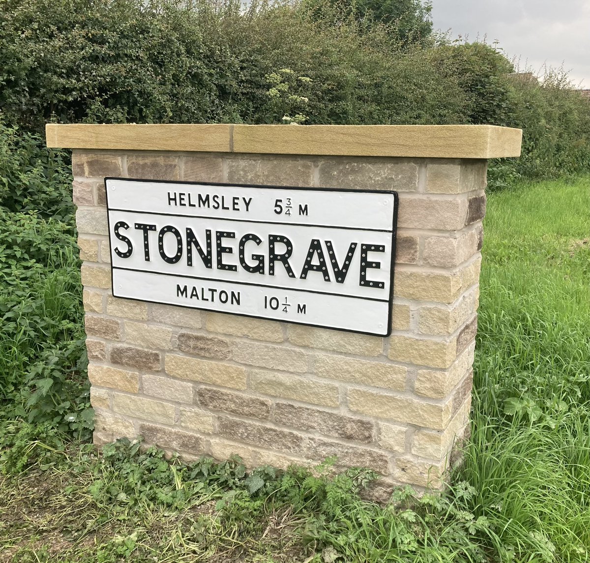 Howardian_Hills's tweet photo. Travelling back from @NatLandAssoc @uknationalparks #greenfinance day, was delighted to spot our smart #stonegrave village sign in place on its equally smart new plinth. These traditional signs are important to the character of the @Howardian_Hills https://t.co/DSTAsFYkkW
