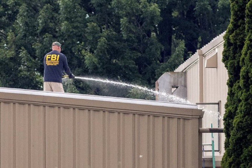 LauraLoomer's tweet photo. Just a photo of the @FBI destroying the crime scene where the shooter opened fire to assassinate President Trump. 

Unreal. https://t.co/P1bwnsObNX
