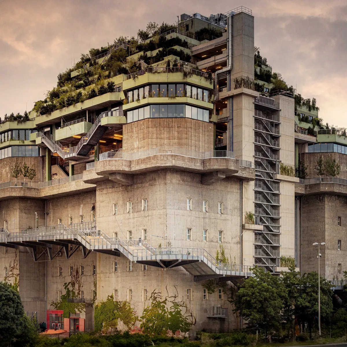 #BrutalWednesday: I'm a little torn here, between admiring the bold turning of 1942 St. Pauli bunker (Hamburg) as a successful case of adaptive reuse, or seeing it as a slightly cheesy example of defacing a surviving wartime icon. I'll go with the first one I think. #architecture
