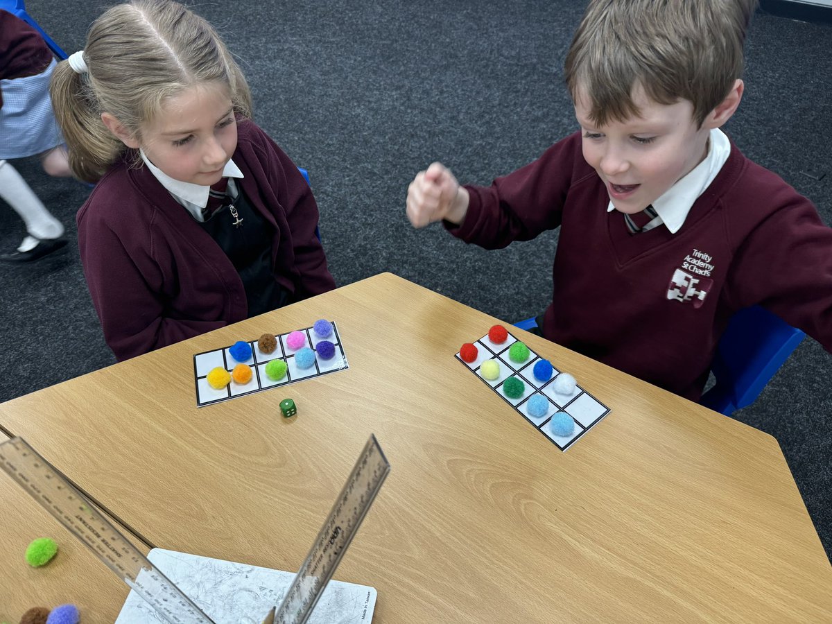 zoevictoria1991's tweet photo. Developing fluency playing an @nrichmaths #mathsgame the children took it in turns to roll a die and place that number of pom-poms onto a ten frame. As they played, they subitised their total and announced how many more they needed to make 10 and win. https://t.co/rDlhQmYR19
