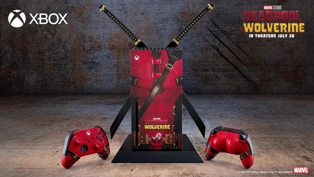 Image of a custom ‘Deadpool & Wolverine’ Xbox Series X console with two katanas attached to the backside and a Deadpool-themed covering, set in an industrial scene. Two Deadpool-themed controllers flank the console: one facing forward and the other backward, revealing a cushion shaped like Deadpool’s buttocks attached to it. The Xbox logo is visible in the bottom left, and the ‘Marvel Studios Deadpool & Wolverine’ logo along with text reading “in theaters July 26” is in the bottom right corner. In the middle, there is text reading “© 2024 20th Century Studios ©&™ 2024 MARVEL” next to the Marvel logo.