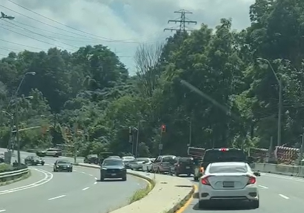 gregmacp's tweet photo. @carynceolin @breakfasttv Would love to know how much the city spent on the massive barriers at Pottery and the Bayview Extension (and at River) ... to presumably block traffic when there's flooding... that never moved yesterday (tangled in weeds) ... so they eventually blocked Bayview with a police car. https://t.co/ZTwcXuXijz