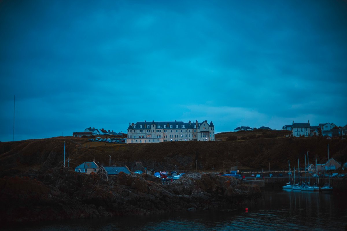 #ThePortpatrickHotel is enormous and overlooks a good chunk of #Portpatrick in #Scotland and their protected harbour. Boats commonly have to raft up with each other as there isn't sufficient dedicated room for each vessel. Captured this after I arrived while it was getting dark.