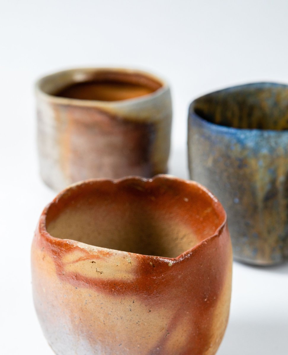 ippodogallery's tweet photo. This Hiyama Bizen Tea Bowl embodies a more traditional aesthetic compared to its contemporary counterparts. Thrown as a cylinder, the bowl undergoes a natural Anagama firing process, resulting in a complex and captivating surface. https://t.co/Cn6Xq1EIlz
