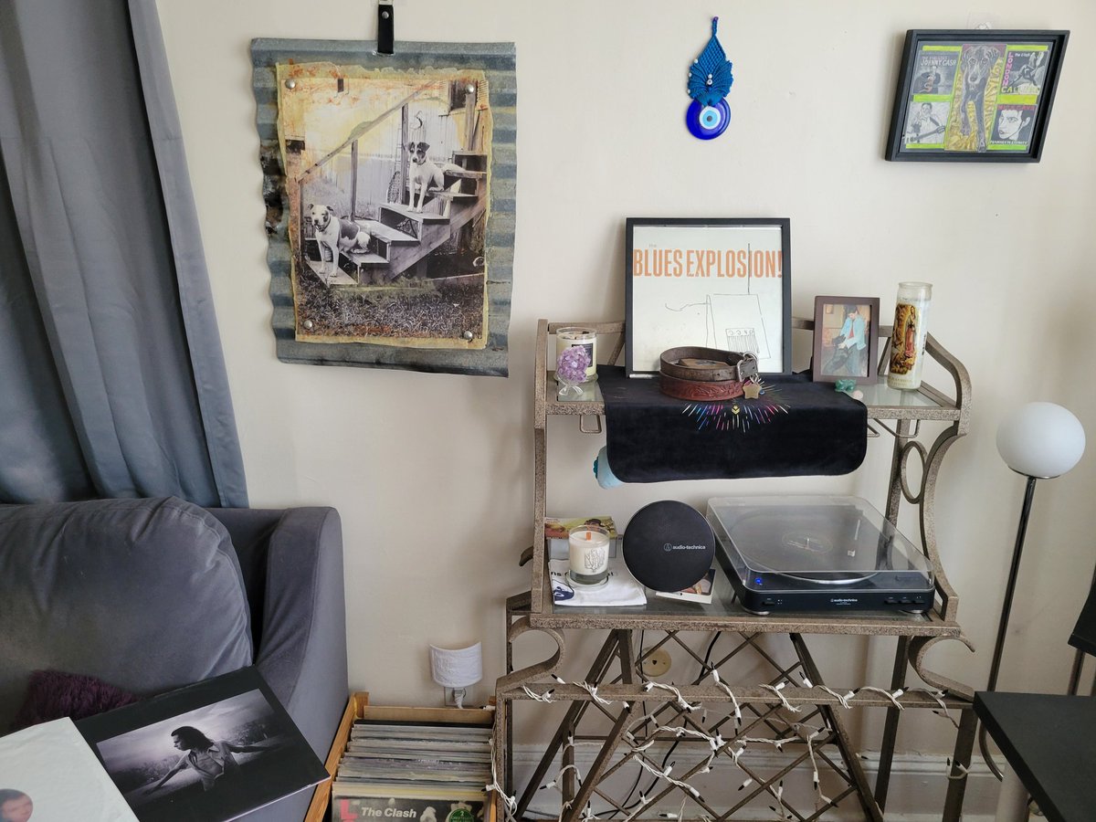 On the 6th year of his passing, I am honoring dad's memory this evening by listening to some of his vinyls (currently Nick Cave). Here's the corner of my living room functioning as a quasi-dad shrine: these are all artworks he either created or owned, and collars of past dogs