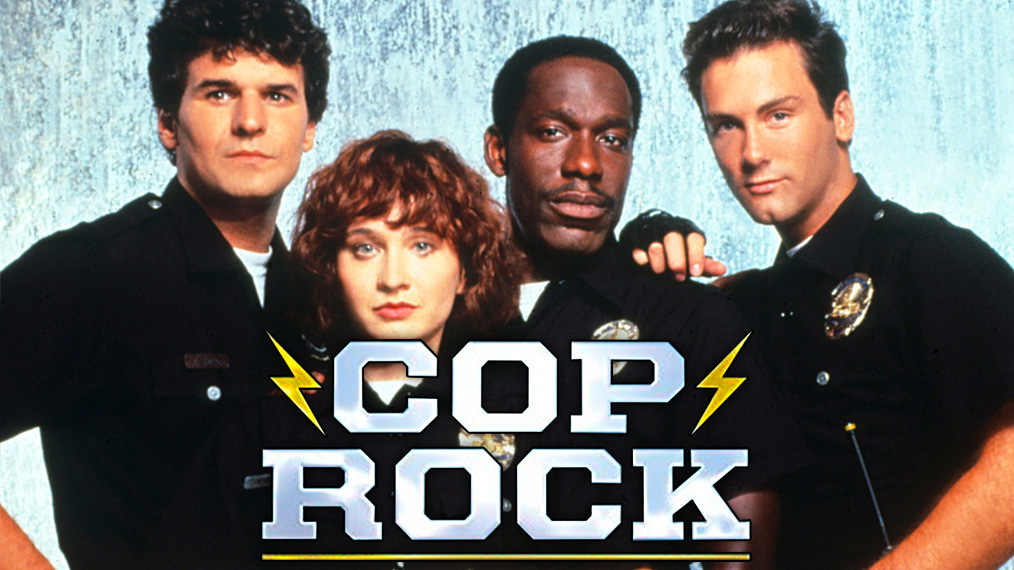 TuomasLius's tweet photo. Who here remembers #CopRock from early 90's? A mercifully short-lived police procedural TV-show with a twist: it was a musical. And yes, it was quite that bad. Check out the pilot: https://t.co/pwHruYVAg3 @JawsomeBrody @LindsayWashburn @NickdeSemlyen @ReganMacarthur @BooksPointof https://t.co/eNZBdaLvKG