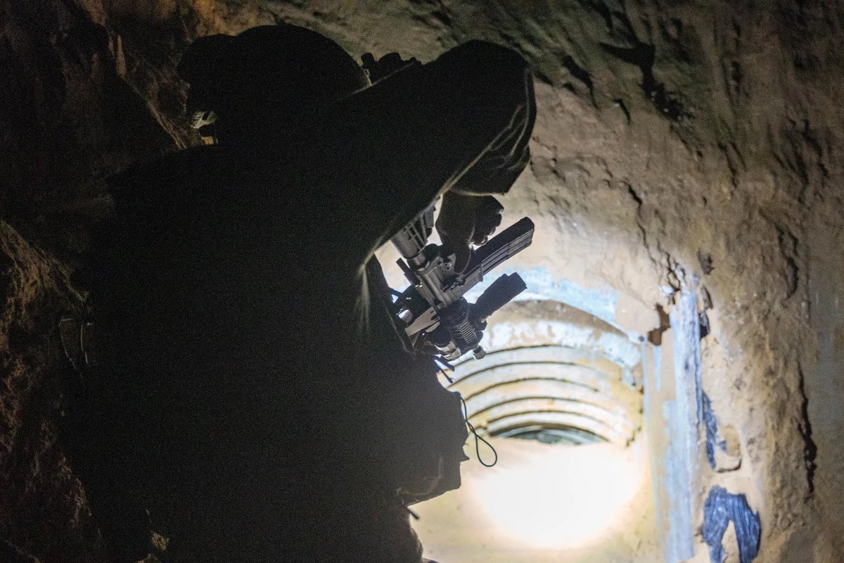 IDFsoldiergirl's tweet photo. Below, #IDFtroops are wiring the tunnel for demolition. The tunnel route is part of another tunnel about 3 kilometers long that was destroyed by our forces in the past. Along the tunnel route, branches, side doors, living space & electrical infrastructure that were used by #Hamas were found & destroyed. #Israel #Gaza #IDF #IDFHeroes #BringThemHomeNow #NeverAgainIsNow