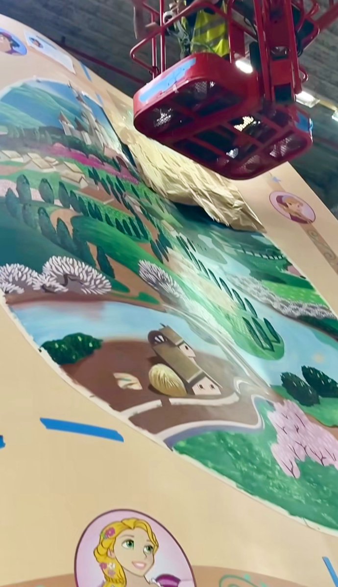 DLPReport's tweet photo. 🎨 Behind the scenes look at the repainting of the iconic “Pays des Contes de Fées” book, which now included new Disney Characters icons: https://t.co/F5dVJpfylx