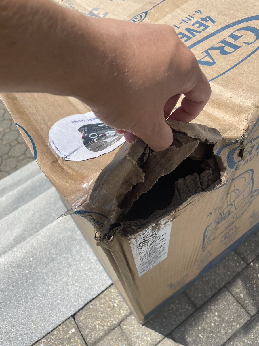 ginavia13's tweet photo. The bar for the quality of @FedEx shipping lately is so far through the floor it lives in one of the inner circles of hell. Anybody want to let me know how this is acceptable for a CAR SEAT to be handled like it was tossed around and left out in the rain with a hole in it?? https://t.co/QOfa4UDJaE