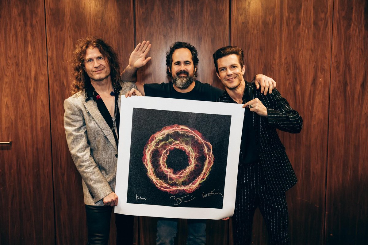 thekillers's tweet photo. While in the UK, we met up again with @soundwaves_art to sign a limited collection of artwork created from the audio of "Be Still". Every artwork has been hand-signed by us and Soundwaves artist Tim Wakefield to support the incredible work of @childreninconflict, a nonprofit organization protecting, educating, and providing psychosocial support to children in war zones across the world. There are only 60 signed prints and 4 originals available. https://t.co/NEfuunR80H