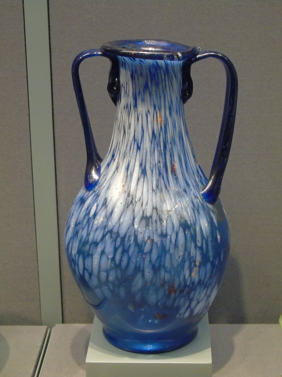 A #Roman glass amphora-shaped jug, made of a beautiful blue glass with white irregular decoration (&amp; the odd spot of colour) - a beautiful piece of #AncientGlass made about 2000 years ago #Archaeology #RomanArchaeology