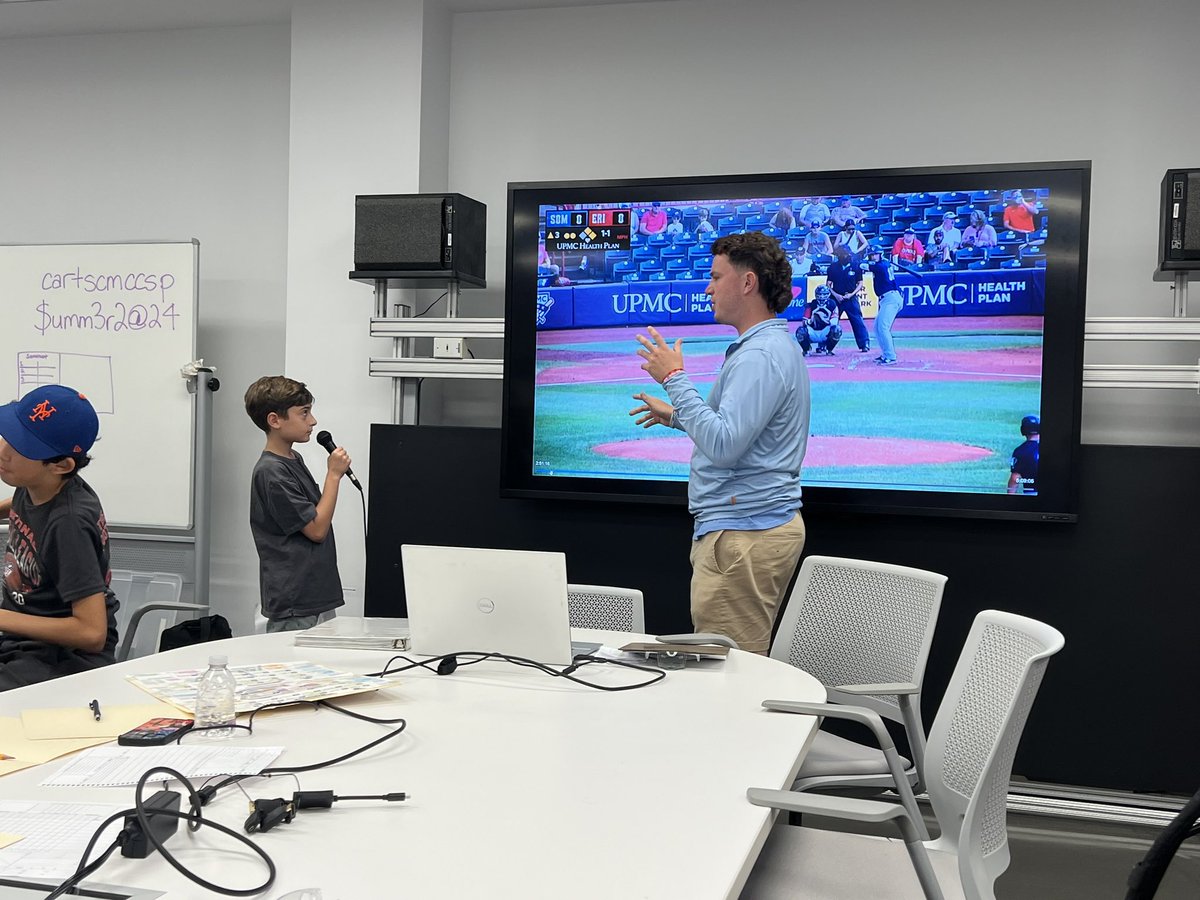 SportsBcastCamp's tweet photo. @12_davidsmith teaching our rookies some play by play! https://t.co/pqyKbFHwN5