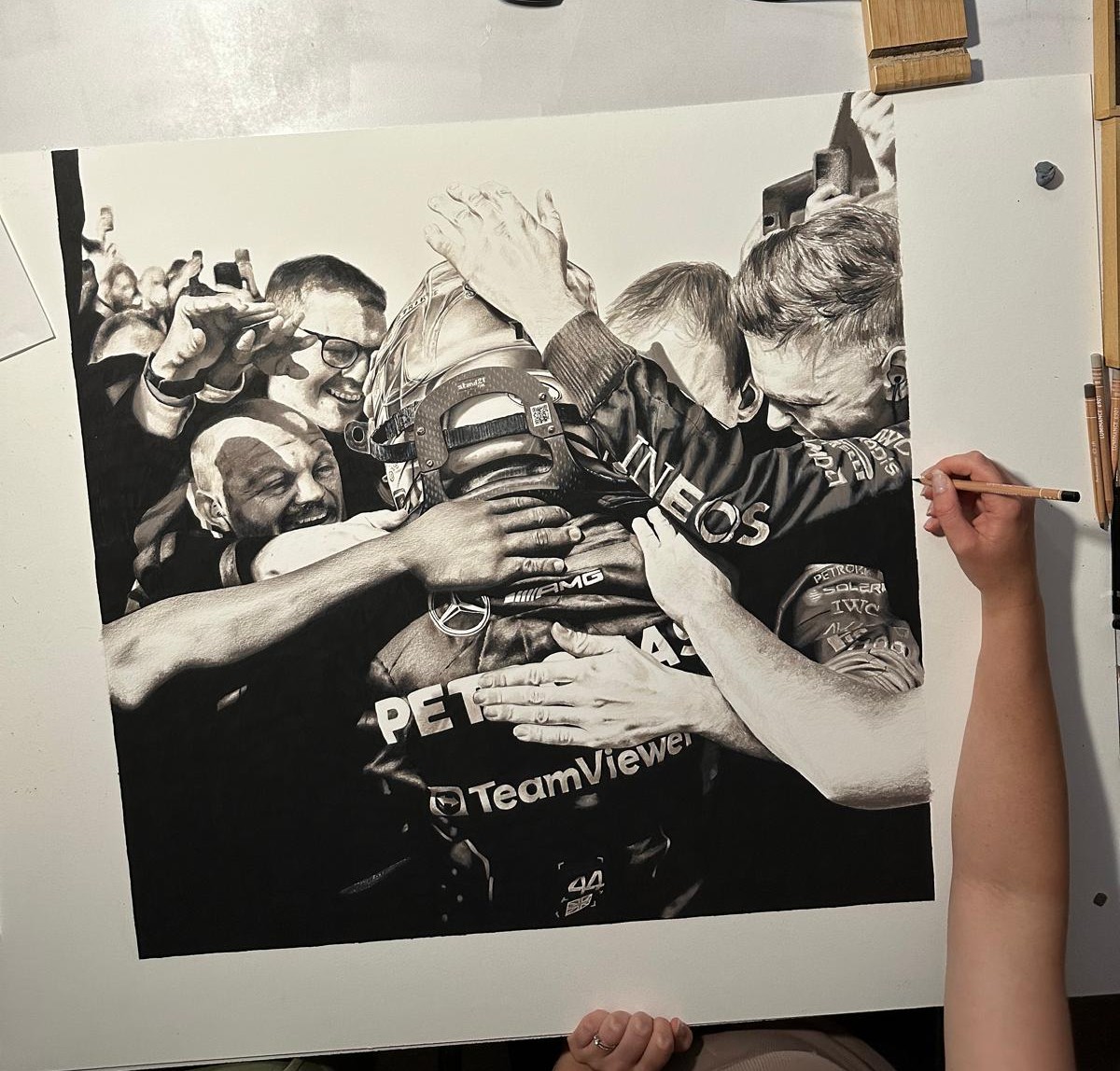 FINISHED!! 
Here is my pencil drawing to celebrate Sir Lewis Hamilton winning at Silverstone. This was such an emotional win and I wanted to focus on his celebration with the team. They all wanted this so much. Well done guys! You deserved it!