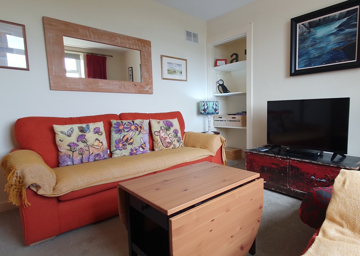 Our living room is light and cosy - we have a Smart TV, family-favourite DVDs, comfy chairs, and tables at just the right height for a glass of local whisky, or welcome cup of tea!

Relax at the Edge of Nowhere at the Lighthouse Keeper’s Cottage.

lighthousekeeperscottage.co.uk

#nc500