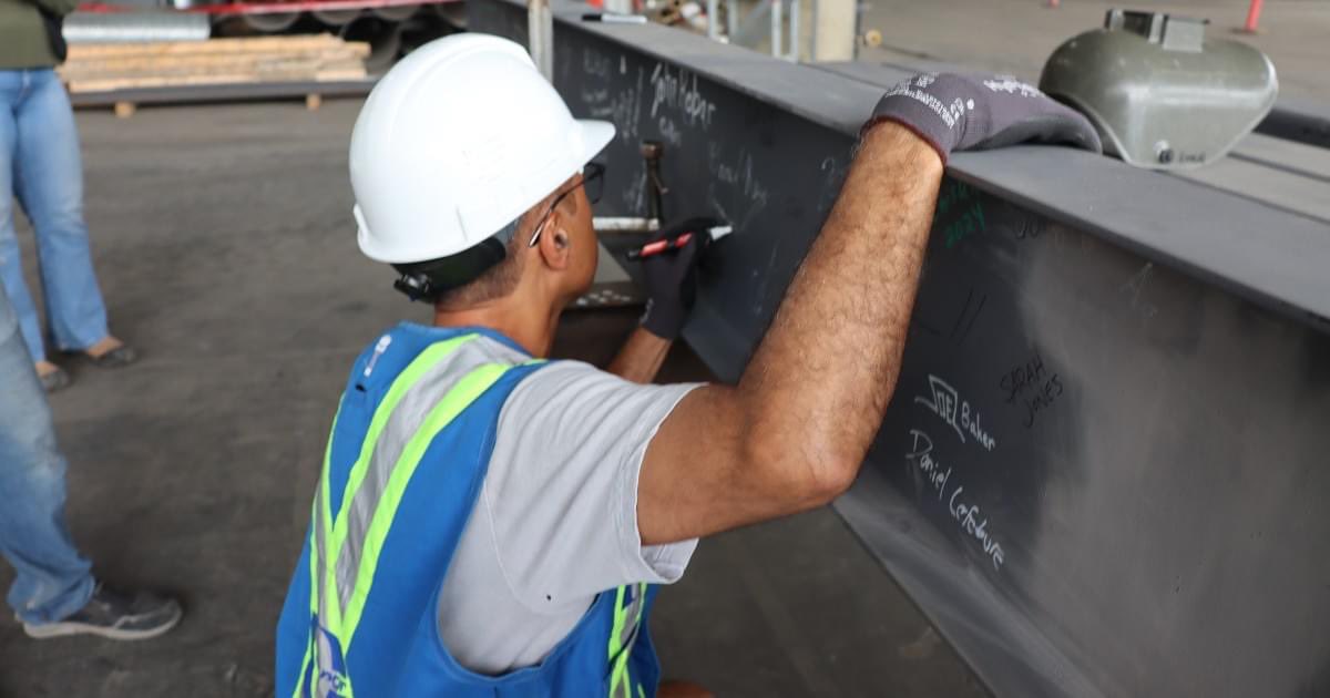 AmarjeetSohiYEG's tweet photo. Today marks a historic milestone for the EXPO Rehabilitation Project as we near the completion of the original hall, formerly known as the Agricom. The last of the 22,052 steel beams will be lifted into place.

I had the privilege of visiting the site to sign my name on the final beam, alongside many other Edmontonians and organizations involved in this renewal effort.

The City of Edmonton is reinvesting in infrastructure for future generations, creating jobs, and upholding our commitment to the Climate Resiliency Plan, by retrofitting city facilities with energy-saving upgrades, we are reducing utility costs and emissions.

The EXPO Rehabilitation Project is scheduled to be completed in January 2025 and will be ready as a new event space attracting concerts, conferences, trade shows and conventions. 

For more information on the project please see the link below: 
https://t.co/GzxXReu8o7

#yegcc #yeg