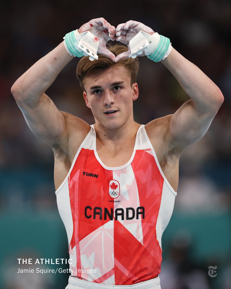 nytimes's tweet photo. From @TheAthletic: There was a heartwarming moment at the men’s gymnastics all-around final. Canada’s Felix Dolci fell hard during his first shot at the horizontal bar. After he returned for a redo, the crowd roared in appreciation. https://t.co/M1T2rVB92D https://t.co/ZFREfjxiQO