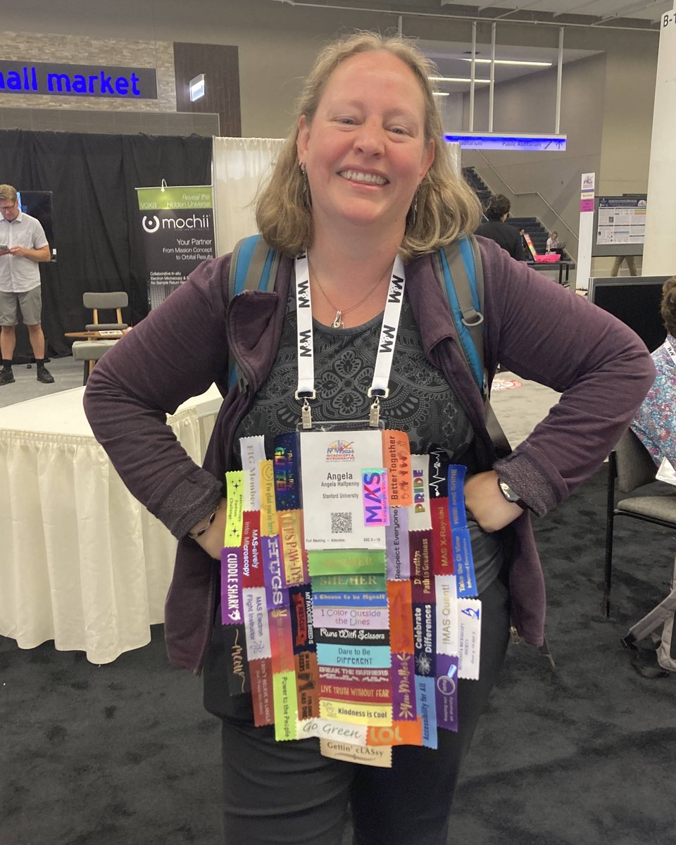 Angela Halfpenny is our submission for most badge ribbons acquired by an #MM2024 attendee.