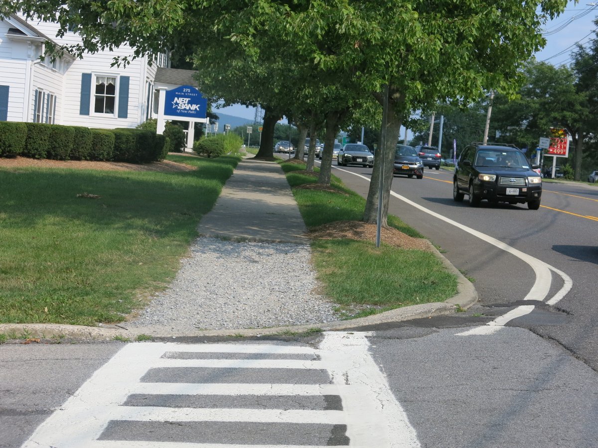 BikeTarrytown's tweet photo. Yeow! The sidewalks in New Paltz are lousy. Narrow. Uneven. Disintegrated. Sad that this lovely village makes walking/wheelchairing so unpleasant. #ADAFail /cc @AlexandriaPaltz https://t.co/xkKypAnqoq
