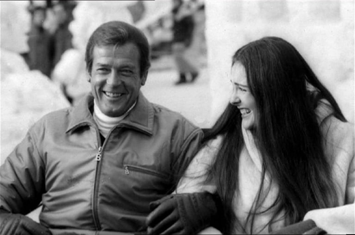 BondinColour's tweet photo. Roger Moore and Carole Bouquet in between scenes in For Your Eyes Only. Apparently Bouquet auditioned for Moonraker and impressed John Glen who cast as lead in #FYEO. #bond #jamesbond #rogermoore #colourised #colourized https://t.co/1kFRE3pFtV