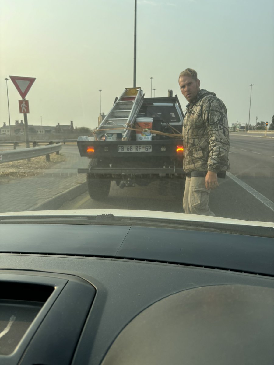 stemzo's tweet photo. This guy pulled a gun on me and my kid while driving her to school. Said “I’ll K!ll your f’ng K@ff!r S”..
He forced me off my lane and blocked me. I closed the window when I saw my daughter crying &amp; drove off.  @Abramjee @TrafficSA @SAPoliceService @EFFSouthAfrica @KayaOnAir https://t.co/fEhGBfQAMo