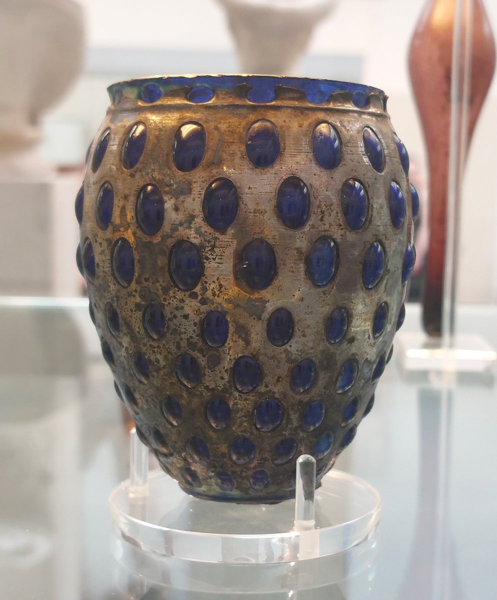 bwallower's tweet image. #GlassObjectThursday
Knobbed #Roman beaker of blue glass blown into silver case, pos from Brindisi 1st C. 
May represent special, apparently fashionable, technique described by elder Pliny where openwork designs were cut out of silver casings for glass, 50-100AD.
@britishmuseum