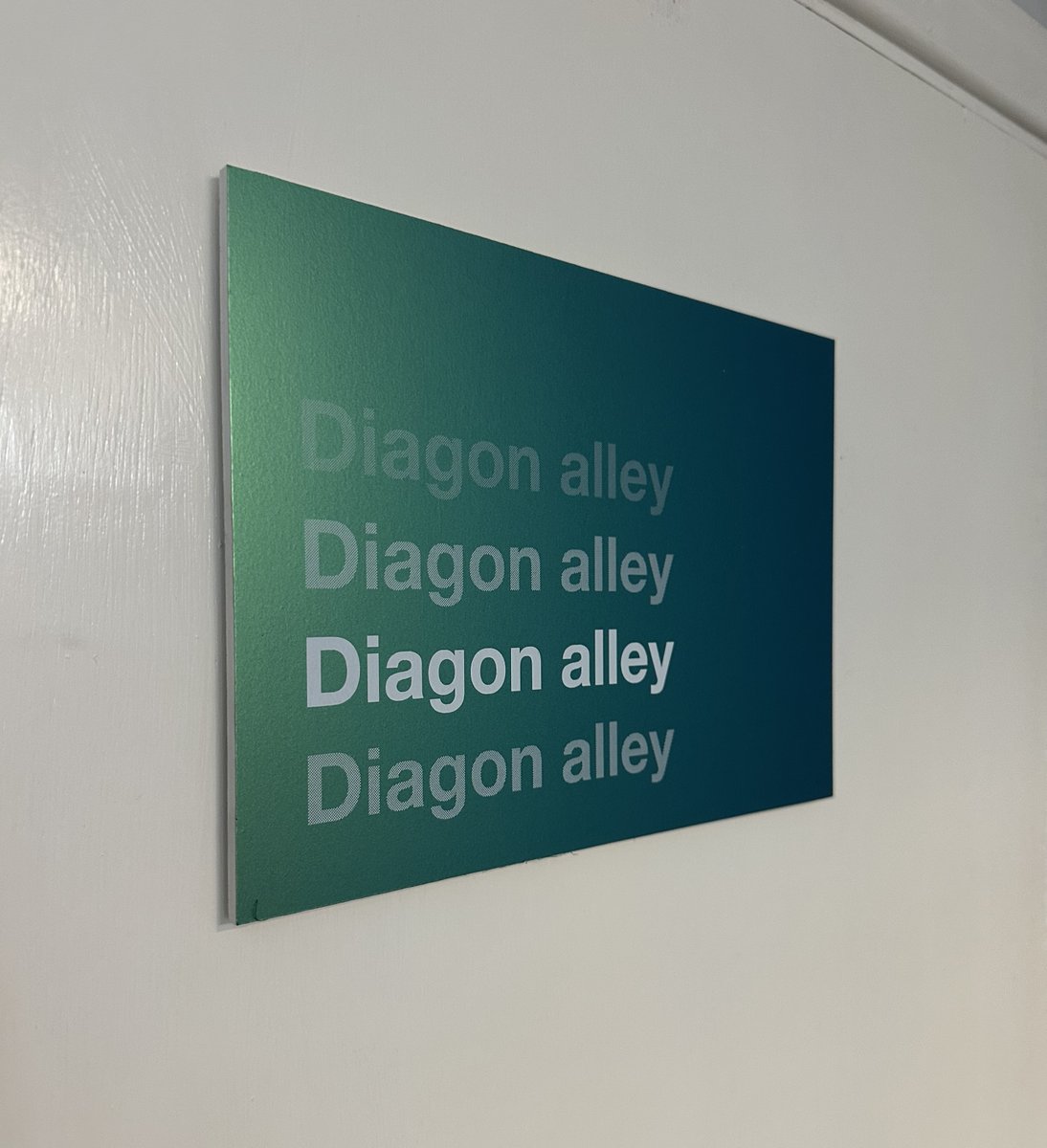 'We need to put a sign on the door that goes out to the alley behind the office.'

'Say no more.'