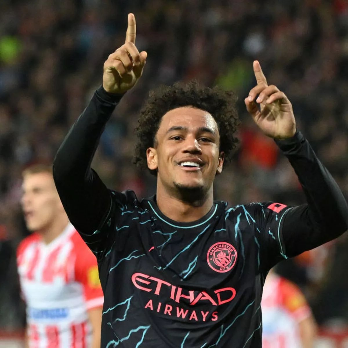 Oscar Bobb celebrates scoring for Manchester City.