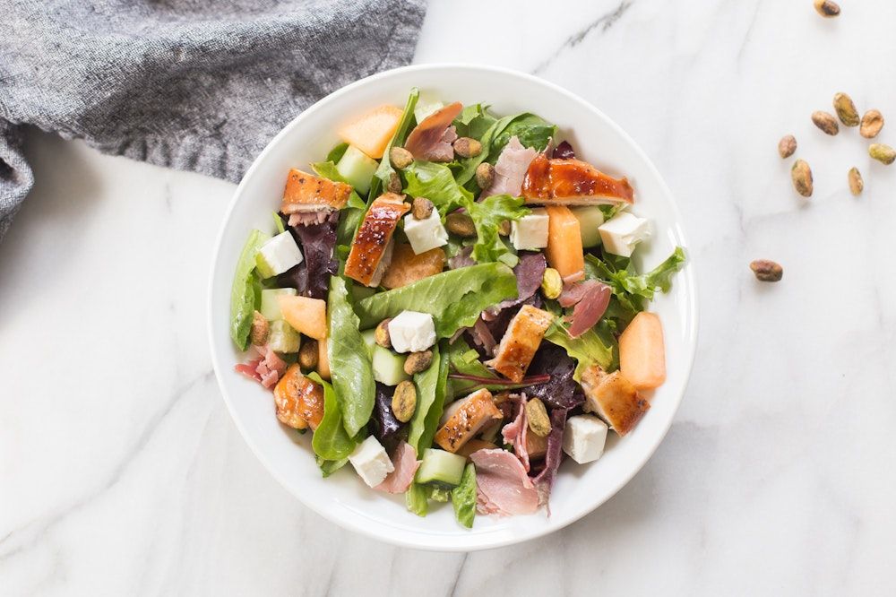 Summer Chopped Chicken Salad | This summery salad is perfect for a hot day. Fresh cantaloupe might sound like an unusual ingredient to add to a salad, but it provides a cool, slightly sweet note to balance out the other ingredients. buff.ly/3SlgXGk #mealplan