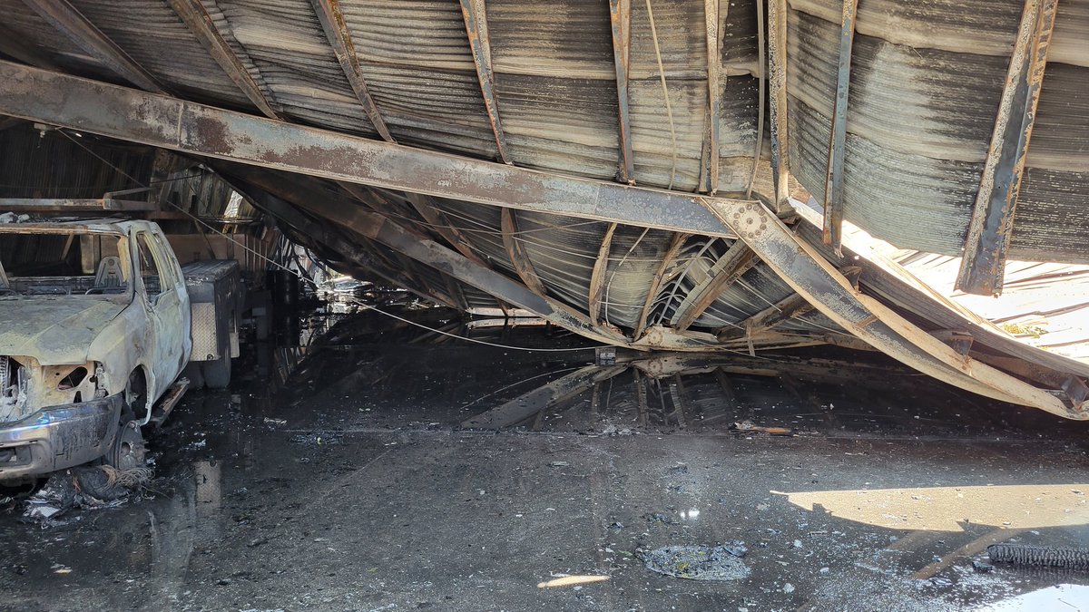 CALFIRE_ButteCo's tweet photo. Crews have contained a structure fire in Gridley. A warehouse at Magnolia and Virginia caught fire this morning and destroyed multiple vehicles. One possible civilian injury. Flames were knocked down within 45 minutes. #GraceFire https://t.co/sUkxTHZWZd