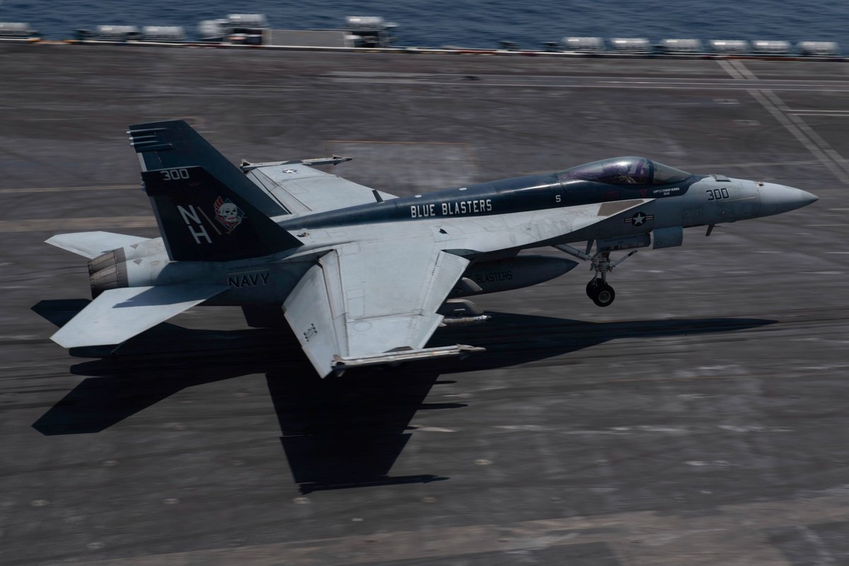 An F/A-18E Super Hornet fighter jet, attached to Strike Fighter