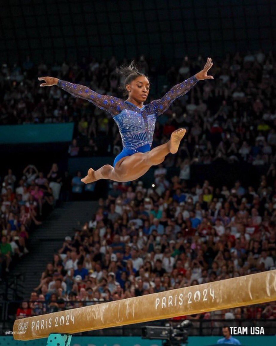TheRickyDavila's tweet photo. Iconic photo of the GOAT mastering her black job and collecting Gold Medals. https://t.co/KCxiew3hH9