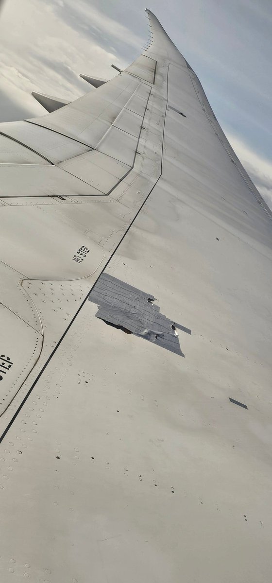 Hermangild's tweet photo. Can someone explain to me why @KenyaAirways uses dark tape to repair planes. This was flight KQ5 traveling from JFK to Nairobi on July 29th https://t.co/8Gtv3dcNHz