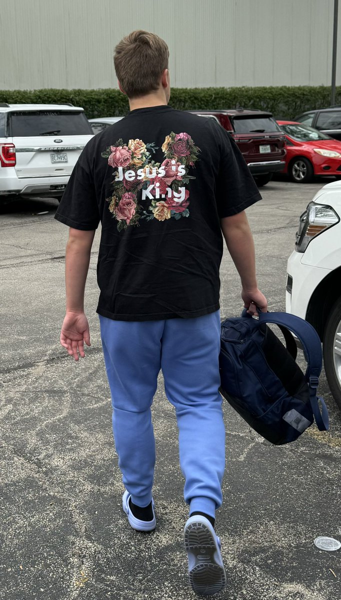 cory_standridge's tweet photo. This kid loves basketball…. And he also loves Jesus.  On his way into a tournament repping for the almighty.  @Tylerst40 https://t.co/ujxCAYnIrK