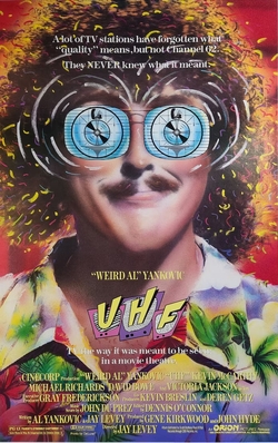 ThatEricAlper's tweet photo. 35 years ago today, "UHF," the comedy film written by and starring Weird Al Yankovic, debuts with a soundtrack full of his song parodies and originals and immediately gains a massive cult following. https://t.co/gcB025mhdq