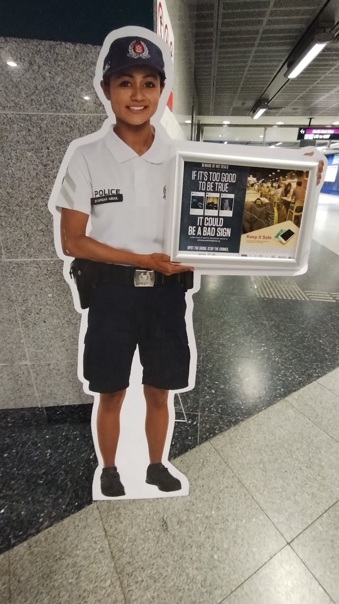 ClaytonFopp's tweet photo. More scams awareness messaging from Singapore. Cardboard standee @singaporepolice officers in the MRT and as commuters come off the escalator. Nearly caused a huge pile-up stopping at the top of the escalator to take the 2nd photo!

#scams
#Scamwatch
#Singapore
#StopCheckProtect https://t.co/B99HvkbLeq
