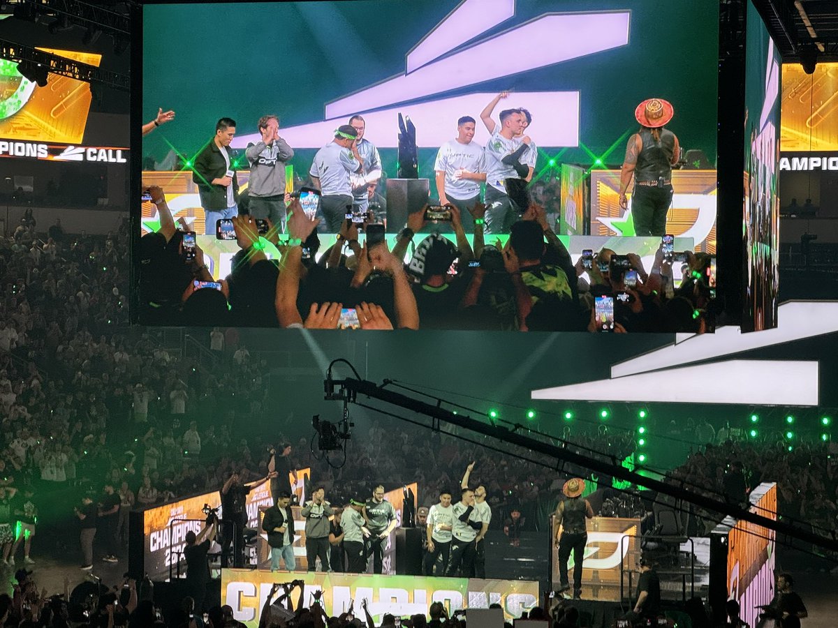 OpTicDrizzle's tweet photo. First time at CHAMPS. What an amazing event. Brick by brick, the Green Wall stands and the ring comes home. Very welll deserved by the @OpTic boys! You all crushed it. Celebrate! Let’s Go Optic!!!! https://t.co/EOVwOrEdJu