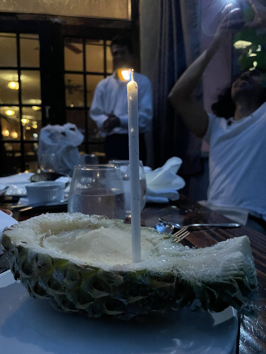 Always a first time for a birthday candle in a frozen pineapple ice cream contraption.